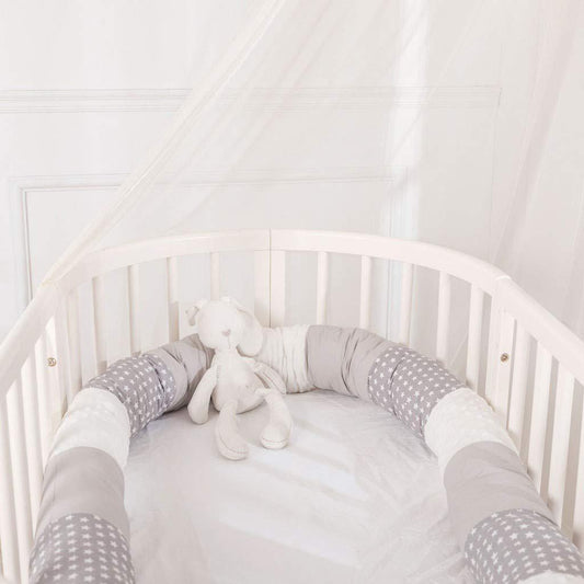 Cylindrical crib bed surrounded by pure cotton